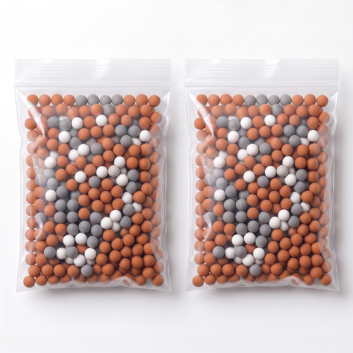 Pack 12 mois : 2 sachets de 55 g de billes minérales mélangées, sur fond blanc